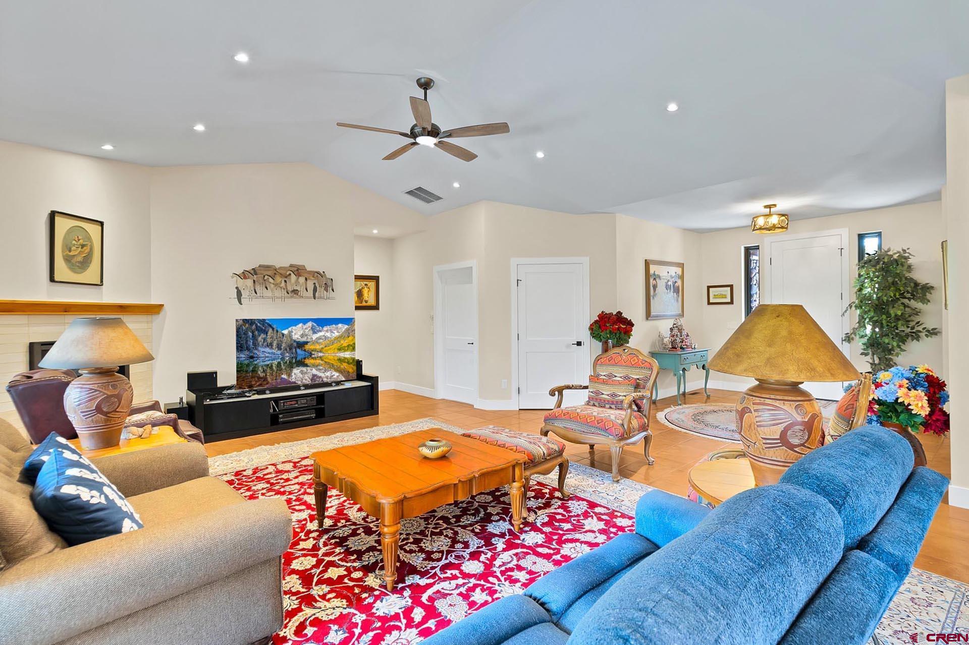 1470 Southeast Stonebridge Drive Cedaredge, CO 81413 - Photo 9 of 42 a living room with furniture and a flat screen tv