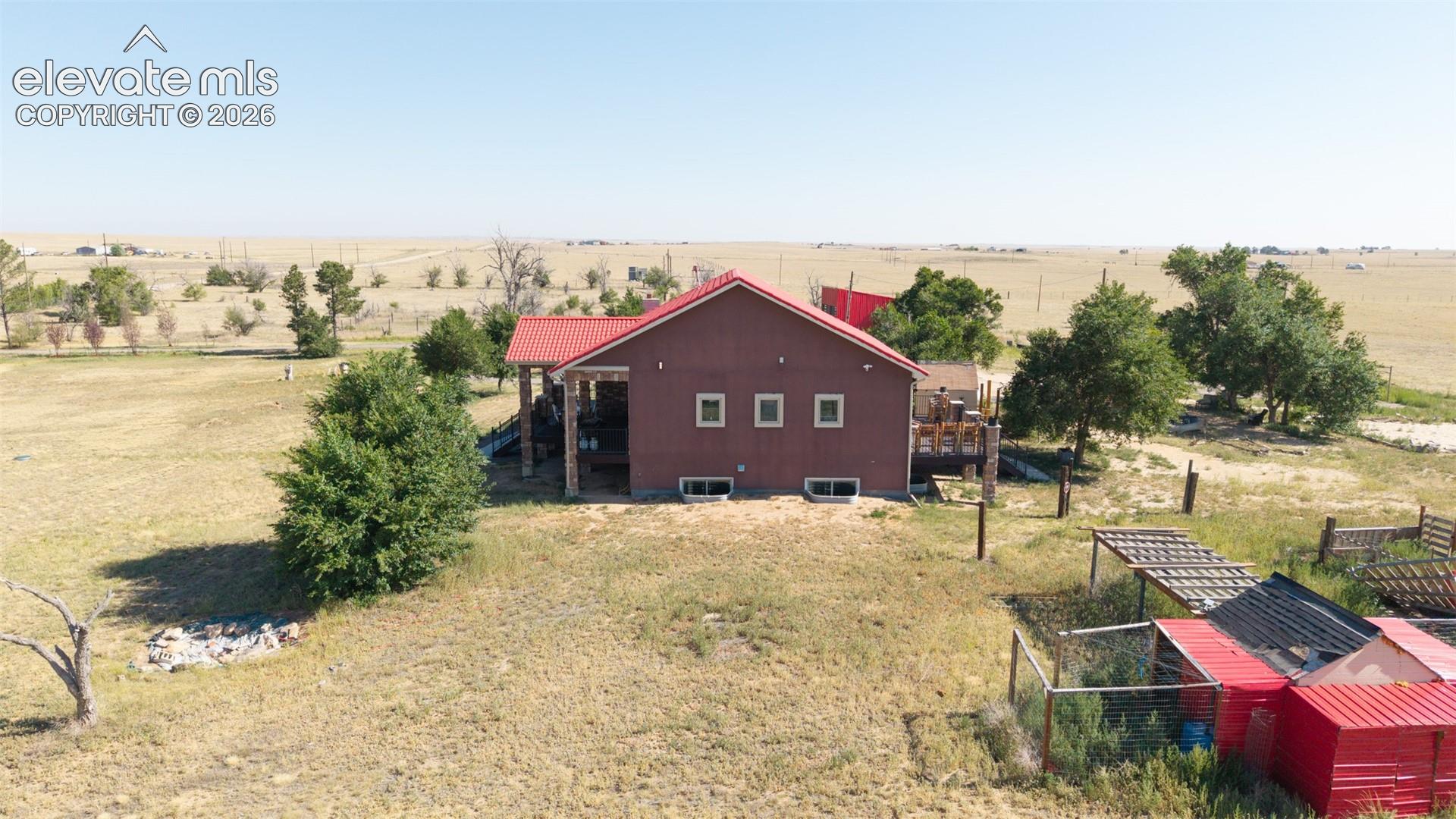 8450 Edison Road Yoder, CO 80864 - Photo 46 of 50 a view of a house with a yard