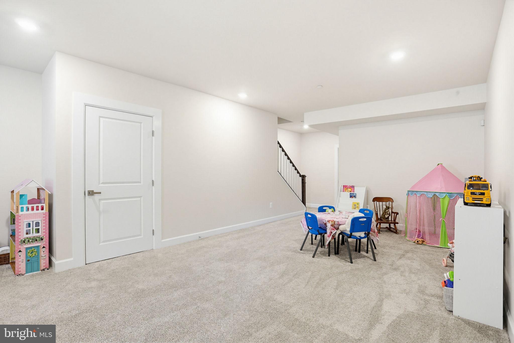 3816 Fulham Road Frederick, MD 21704 - Photo 34 of 77 a view of a room with furniture and chandelier