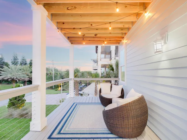 a view of a balcony with lake view and a potted plant