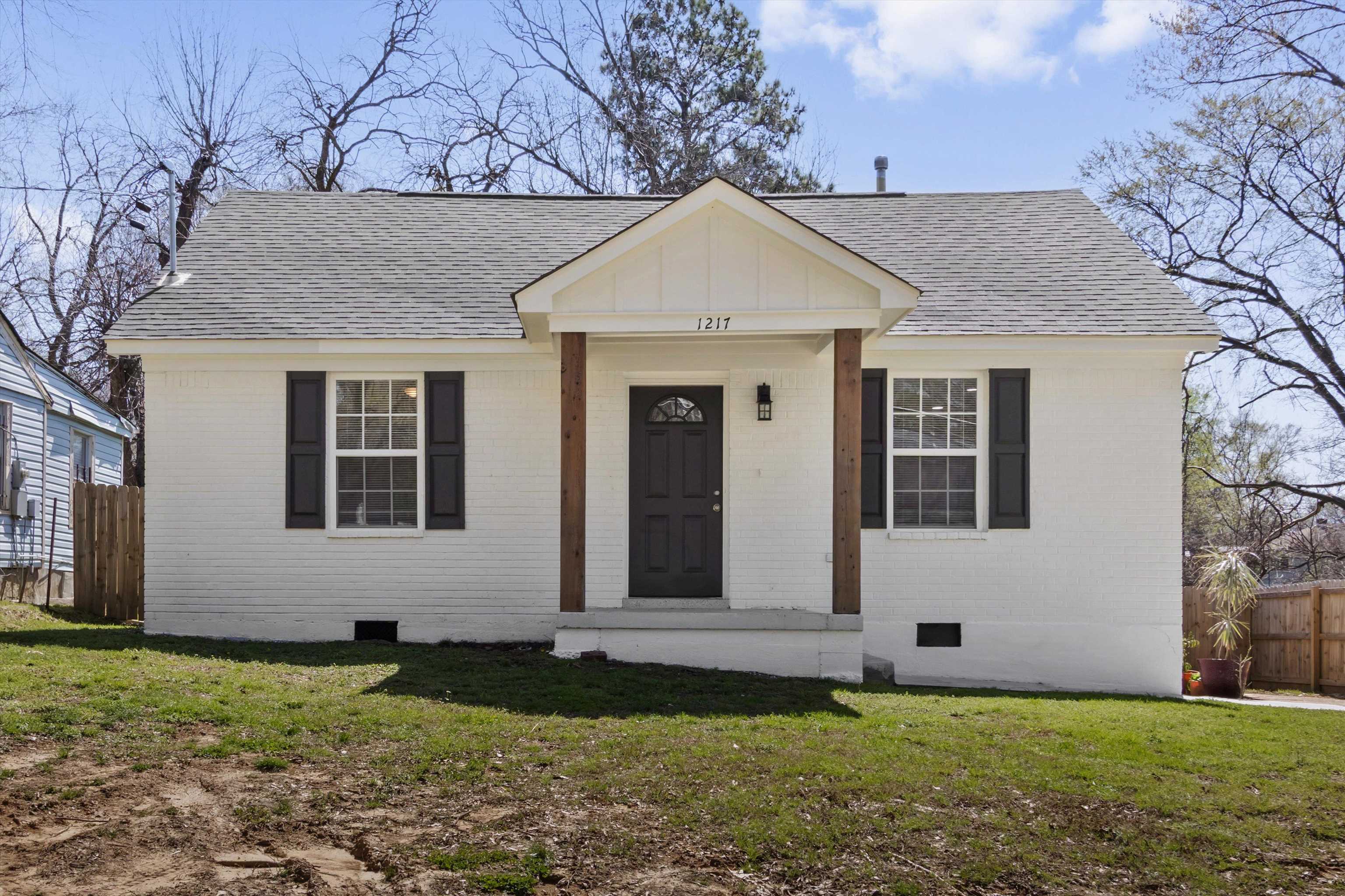 1217 Carlton Road Memphis, TN 38106 - Photo 1 of 32 View of front of home featuring crawl space, brick siding, and a shingled roof