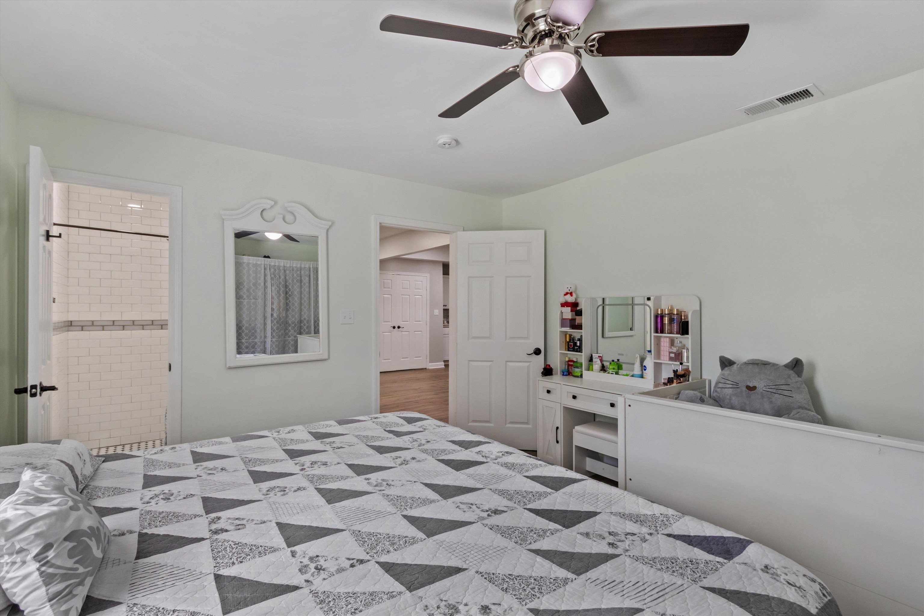 1217 Carlton Road Memphis, TN 38106 - Photo 14 of 32 Bedroom featuring ceiling fan and connected bathroom