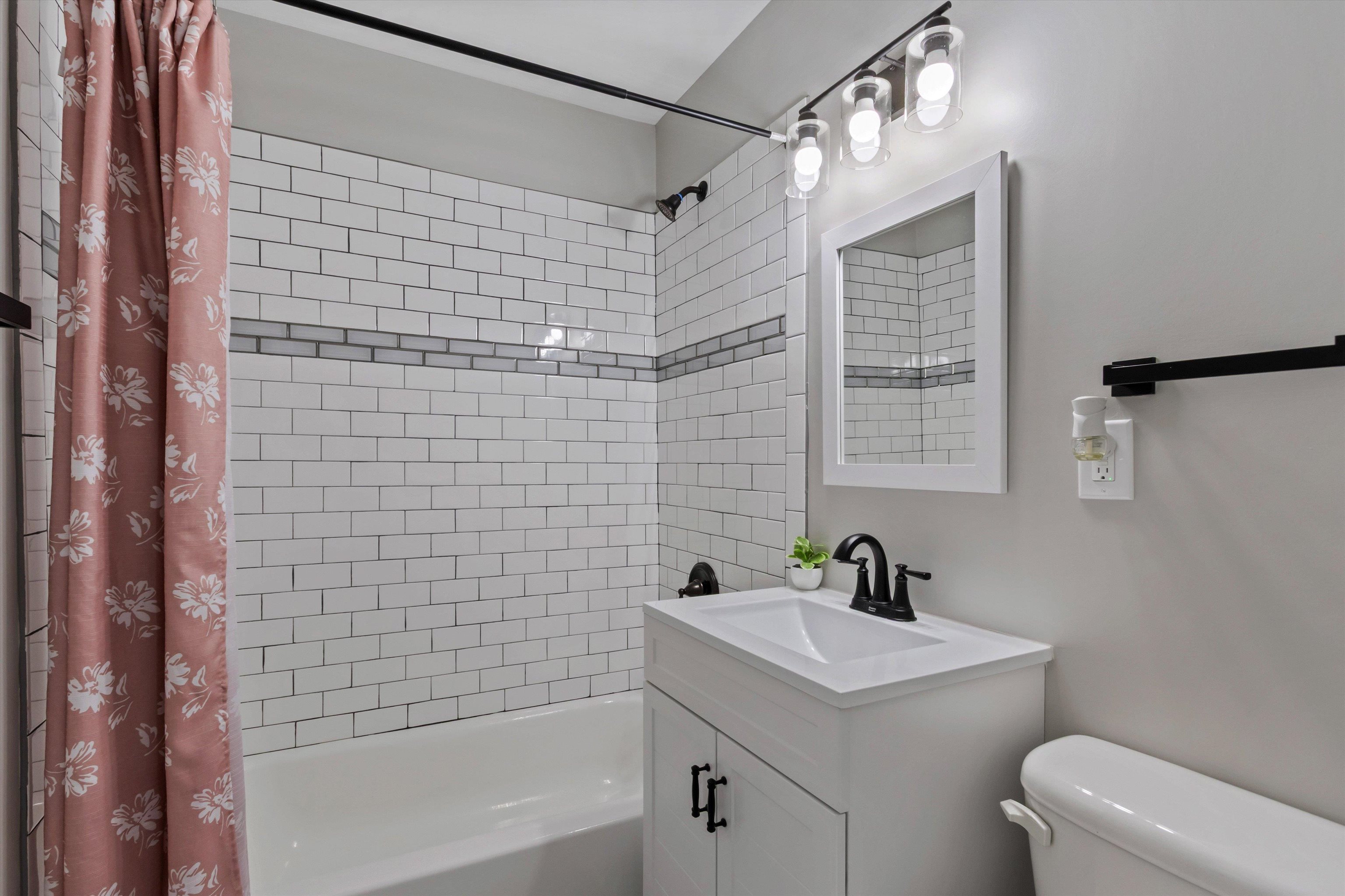 1217 Carlton Road Memphis, TN 38106 - Photo 19 of 32 Full bathroom featuring vanity and shower / bathtub combination with curtain