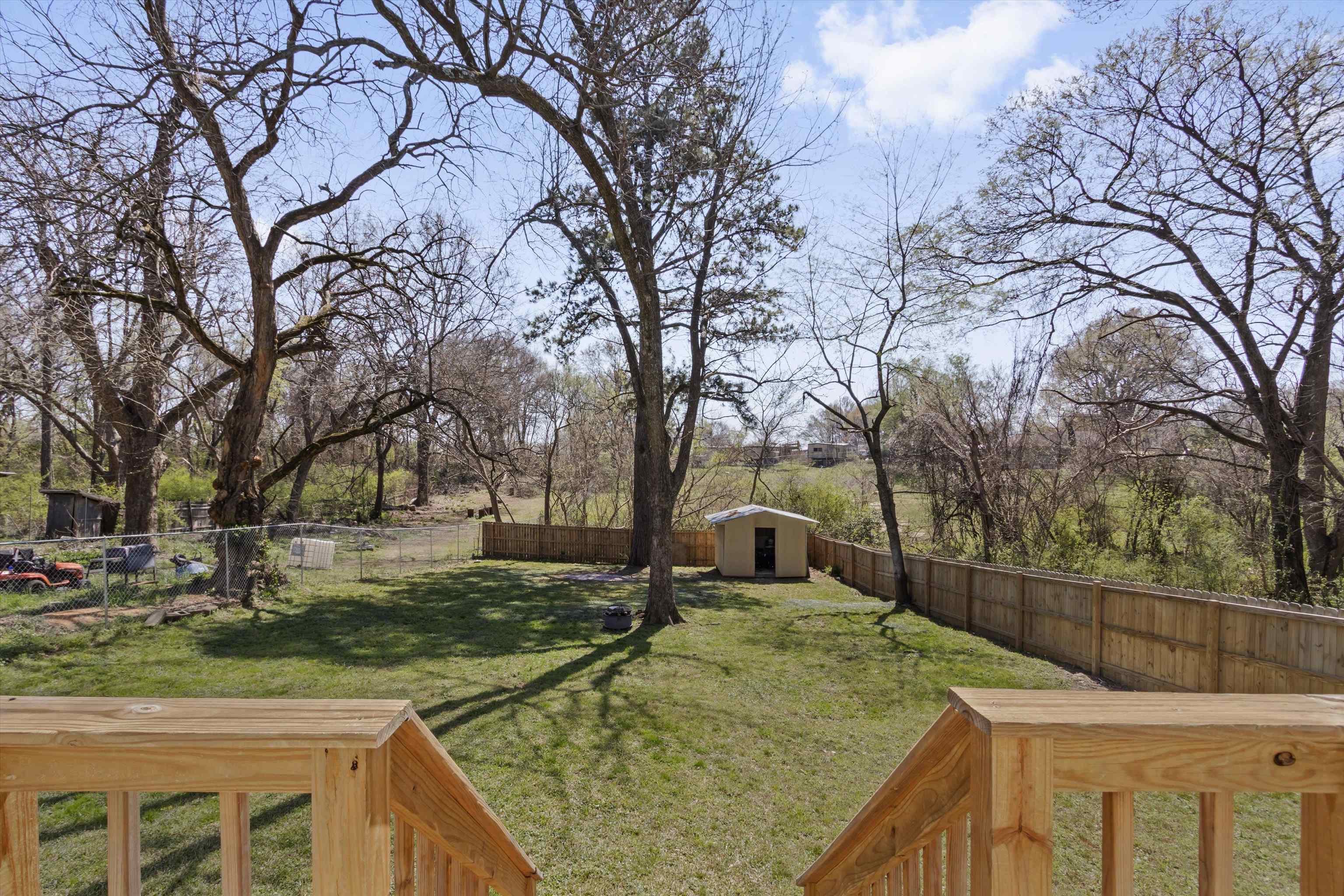 1217 Carlton Road Memphis, TN 38106 - Photo 21 of 32 Fenced backyard with a shed