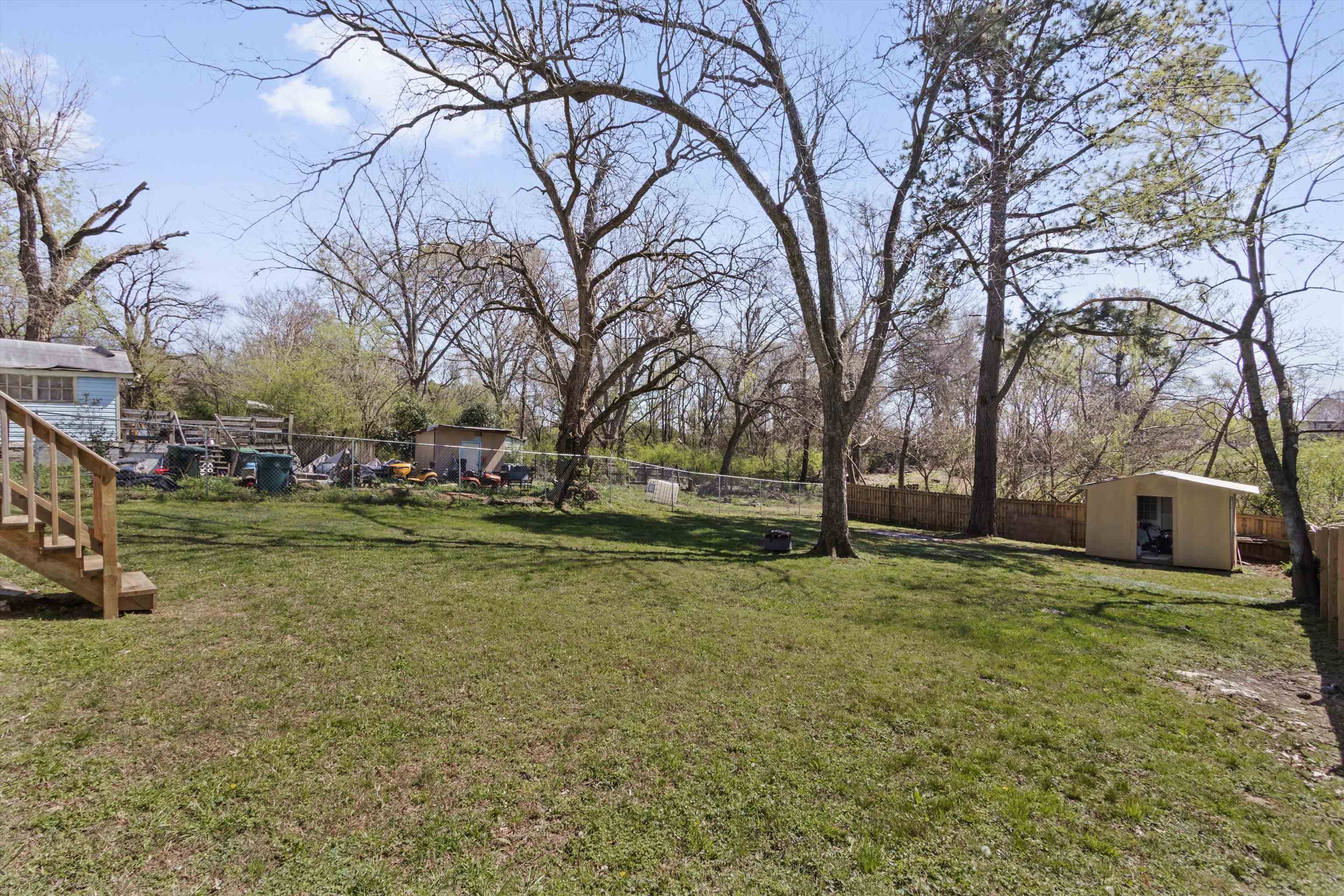 1217 Carlton Road Memphis, TN 38106 - Photo 22 of 32 Fenced backyard with a storage unit