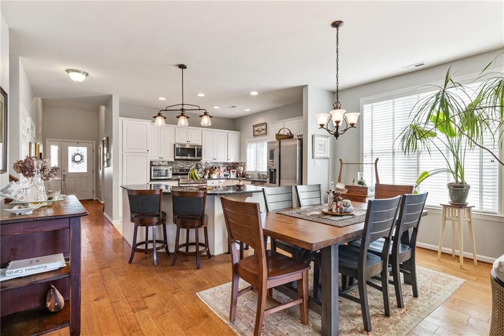 140 Independence Way Sewickley, PA 15143 - Photo 13 of 33 a view of a dining room and livingroom with furniture wooden floor a chandelier