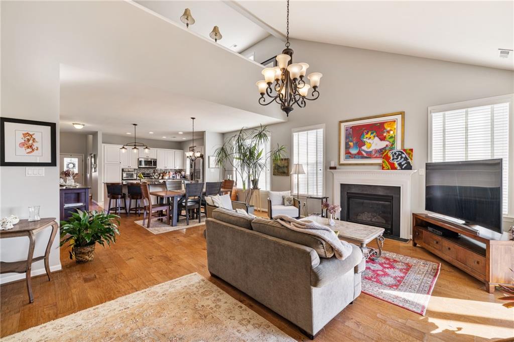 140 Independence Way Sewickley, PA 15143 - Photo 15 of 33 a living room with furniture a chandelier and a fireplace