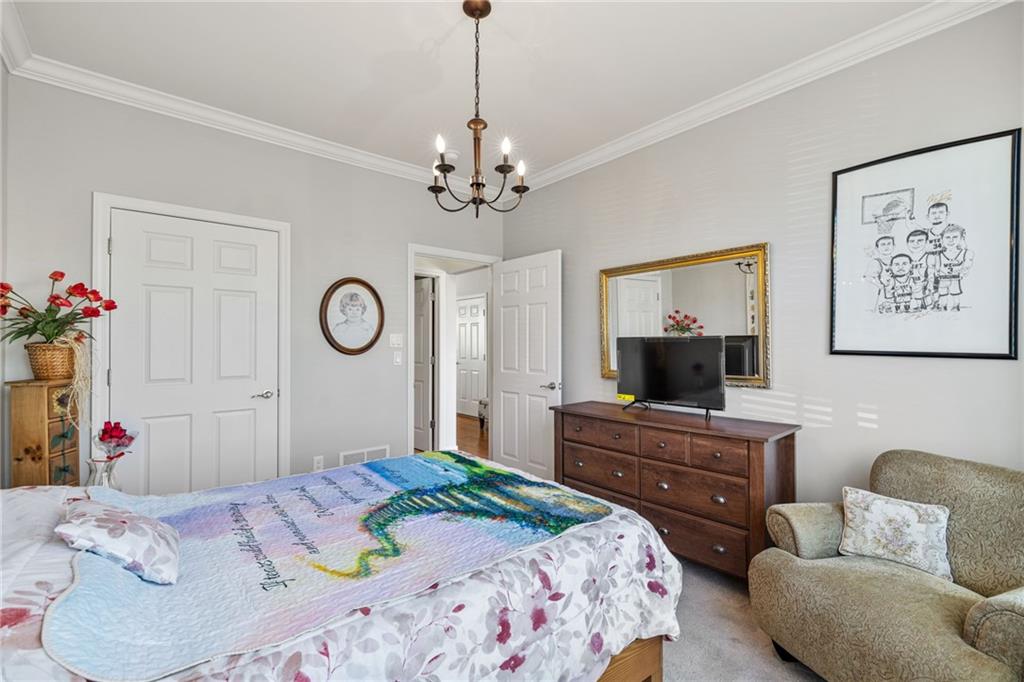 140 Independence Way Sewickley, PA 15143 - Photo 19 of 33 a bedroom with a bed dresser and a flat screen tv