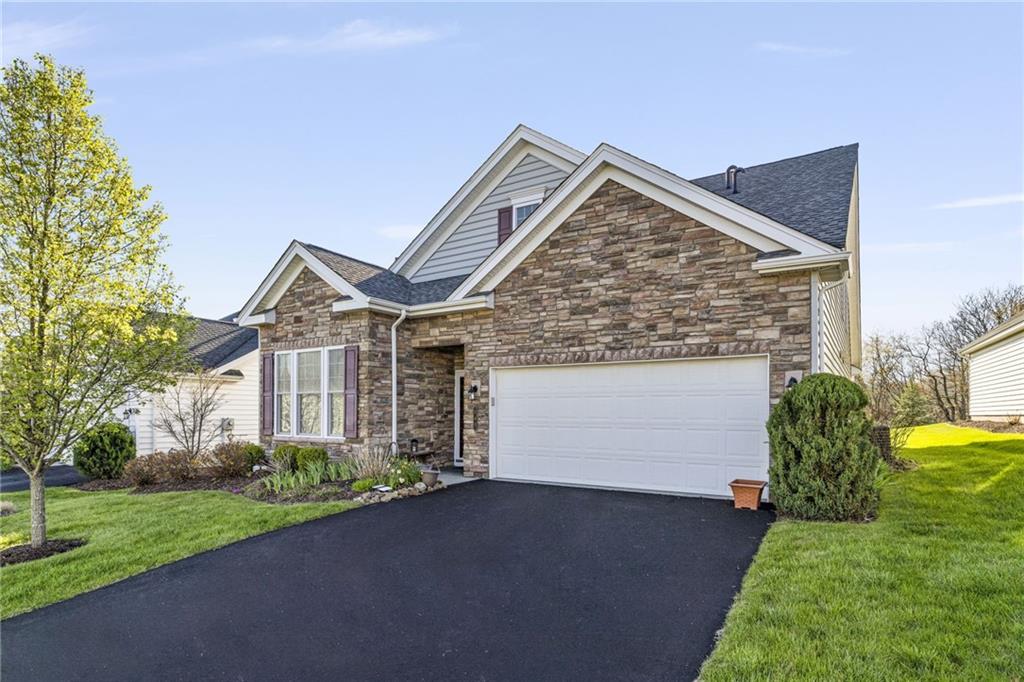 140 Independence Way Sewickley, PA 15143 - Photo 2 of 33 a front view of a house with garden