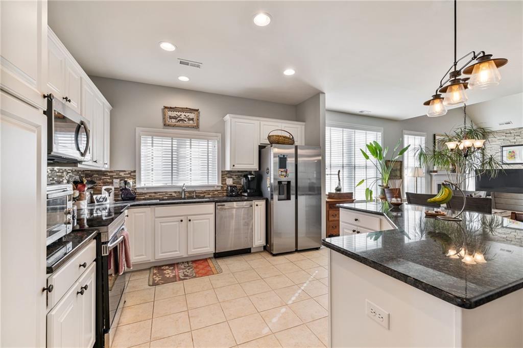 140 Independence Way Sewickley, PA 15143 - Photo 7 of 33 a kitchen with a sink refrigerator and cabinets