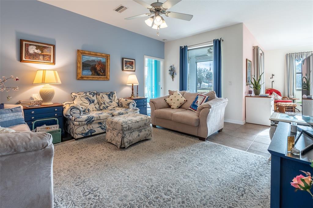 15969 Southwest 14th Avenue Road Ocala, FL 34473 - Photo 3 of 46 a living room with furniture and a chandelier