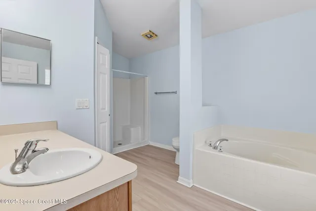 a bathroom with a bathtub and a sink