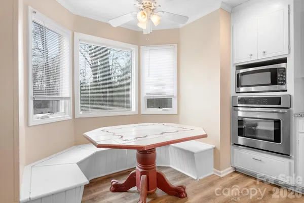 a kitchen with a sink cabinets and stainless steel appliances