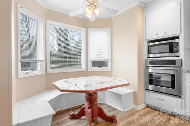 a kitchen with a sink cabinets and stainless steel appliances
