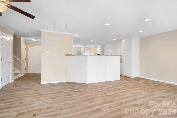 a view of kitchen and wooden floor