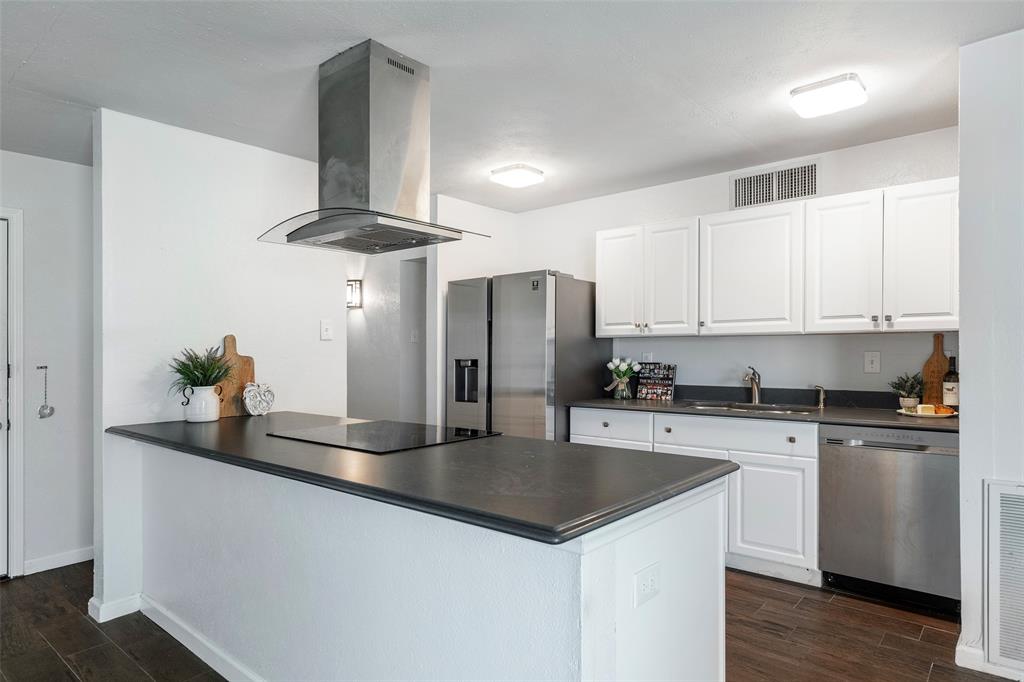 5236 Arbor Glen Road The Colony, TX 75056 - Photo 1 of 1 a kitchen with stainless steel appliances a sink a stove a refrigerator and cabinets