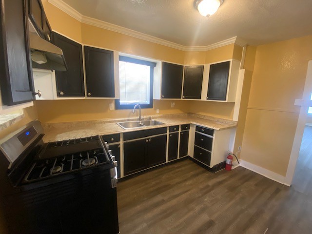 214 South Hackberry Avenue Luling, TX 78648 - Photo 8 of 22 a kitchen with stainless steel appliances granite countertop a stove and a refrigerator