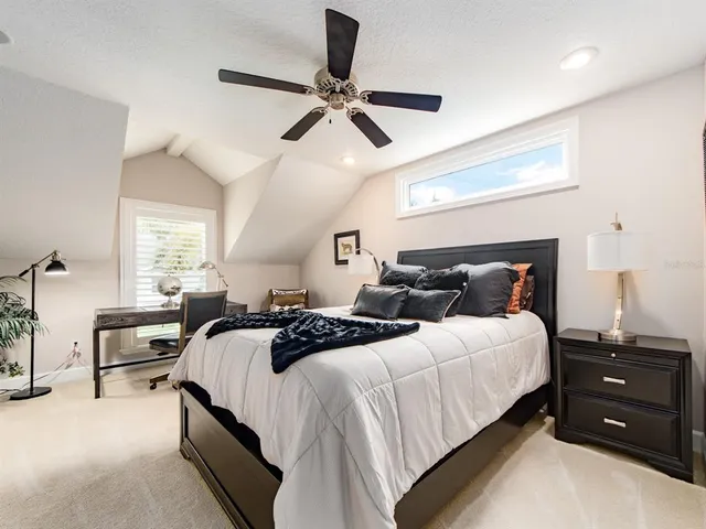 a bedroom with bed and window