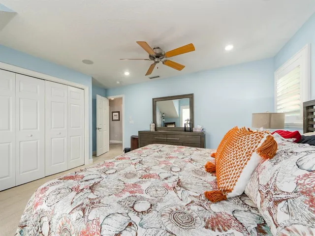 a bedroom with a bed and a tv