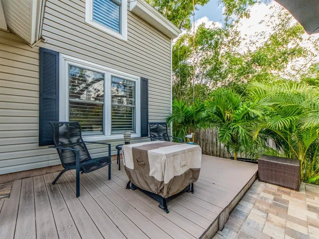 a balcony with furniture and wooden floor