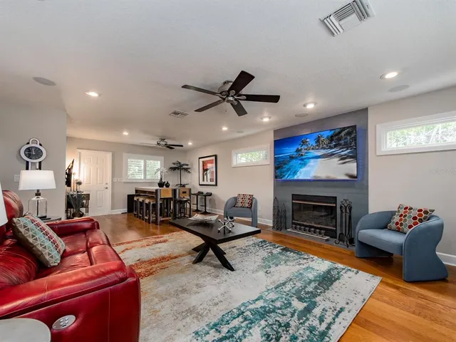 a living room with furniture or couch and a fireplace
