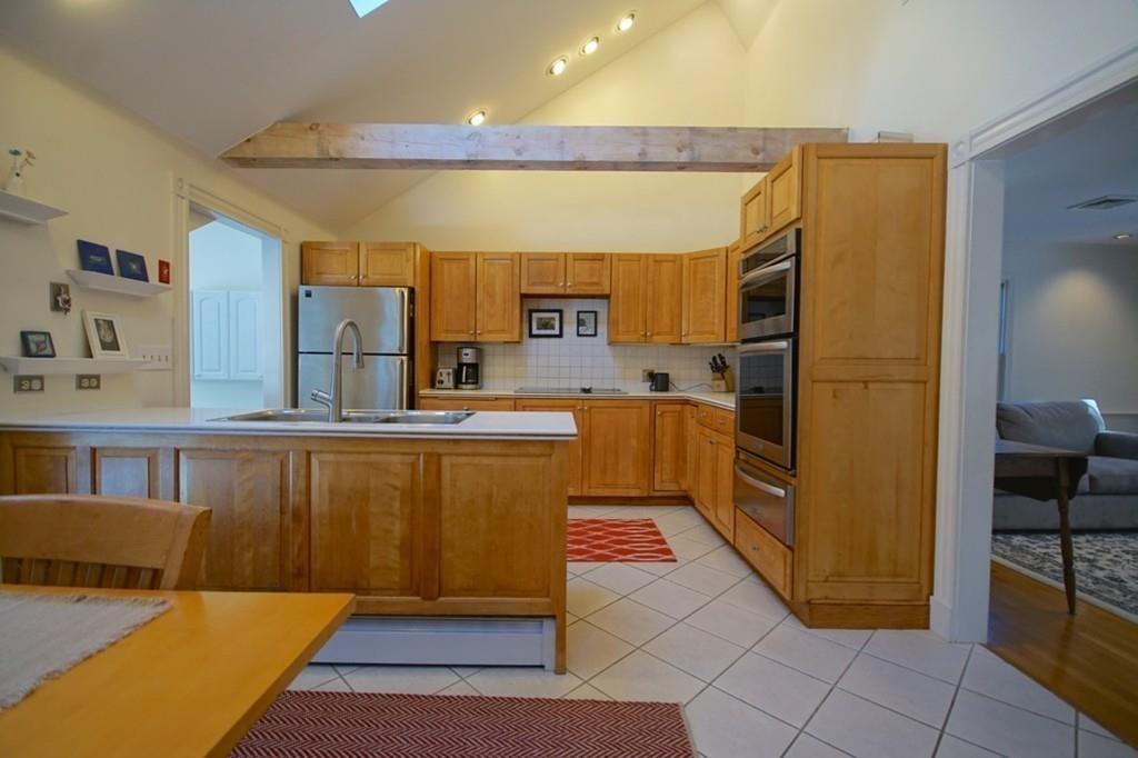 19 Towne Road Boxford, MA 01921 - Photo 13 of 39 a kitchen with stainless steel appliances a refrigerator and a stove