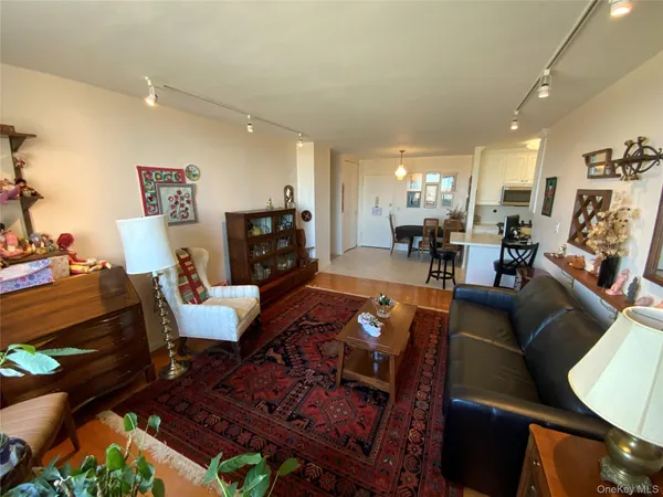 a living room with fireplace furniture and a dining table