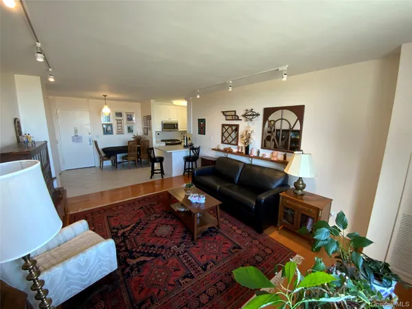 a living room with furniture fireplace and a potted plant