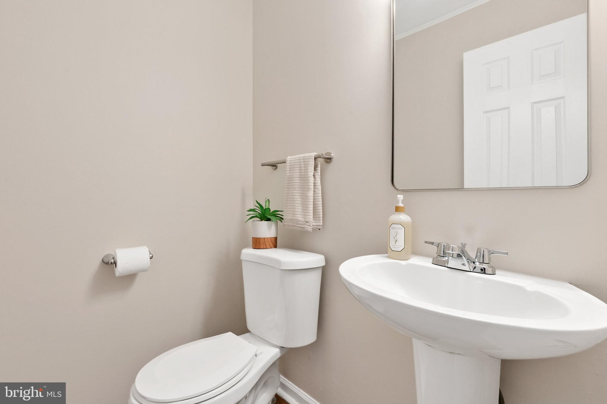 3133 Beaverwood Lane Silver Spring, MD 20906 - Photo 17 of 41 a bathroom with a sink a toilet and mirror