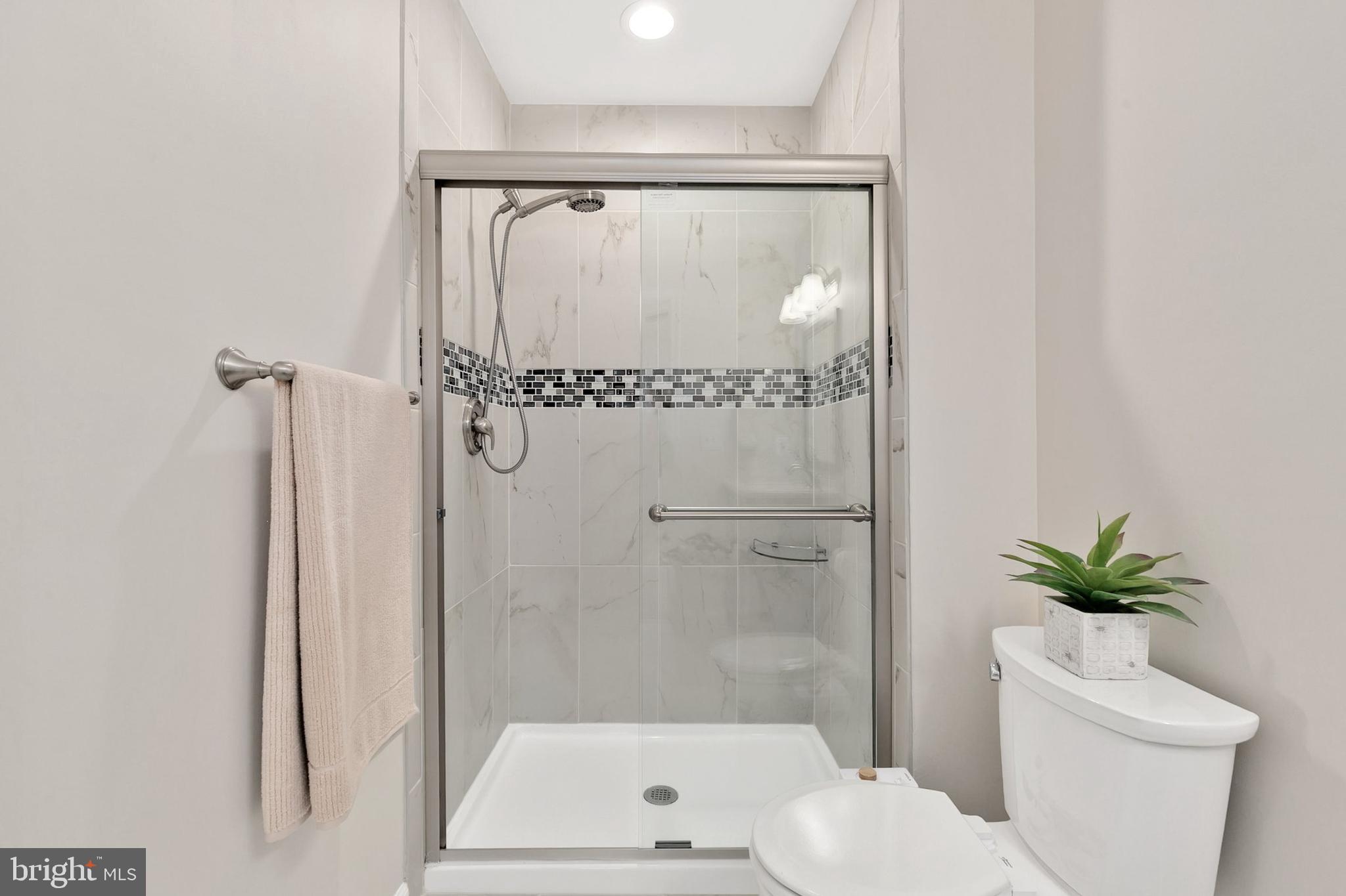 3133 Beaverwood Lane Silver Spring, MD 20906 - Photo 23 of 41 a bathroom with a shower a toilet and a shower