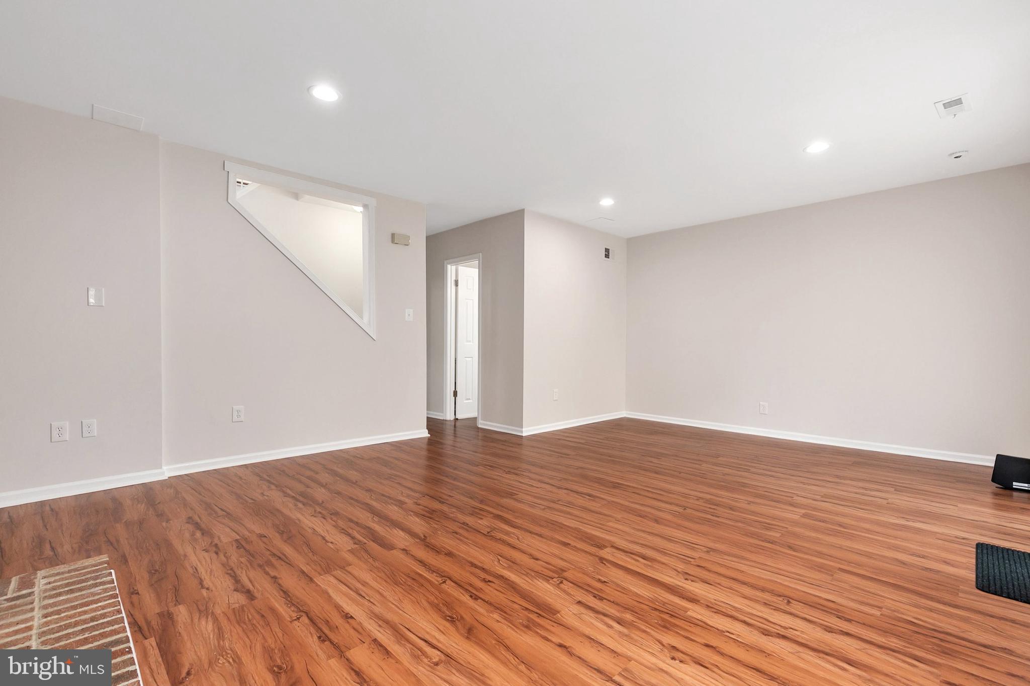 3133 Beaverwood Lane Silver Spring, MD 20906 - Photo 32 of 41 a view of an empty room with wooden floor