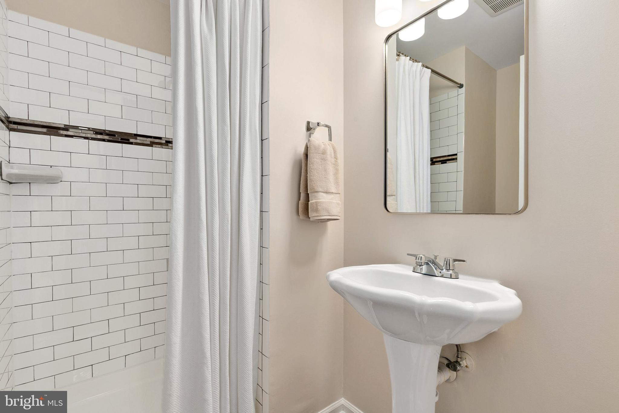 3133 Beaverwood Lane Silver Spring, MD 20906 - Photo 34 of 41 a bathroom with a sink and mirror