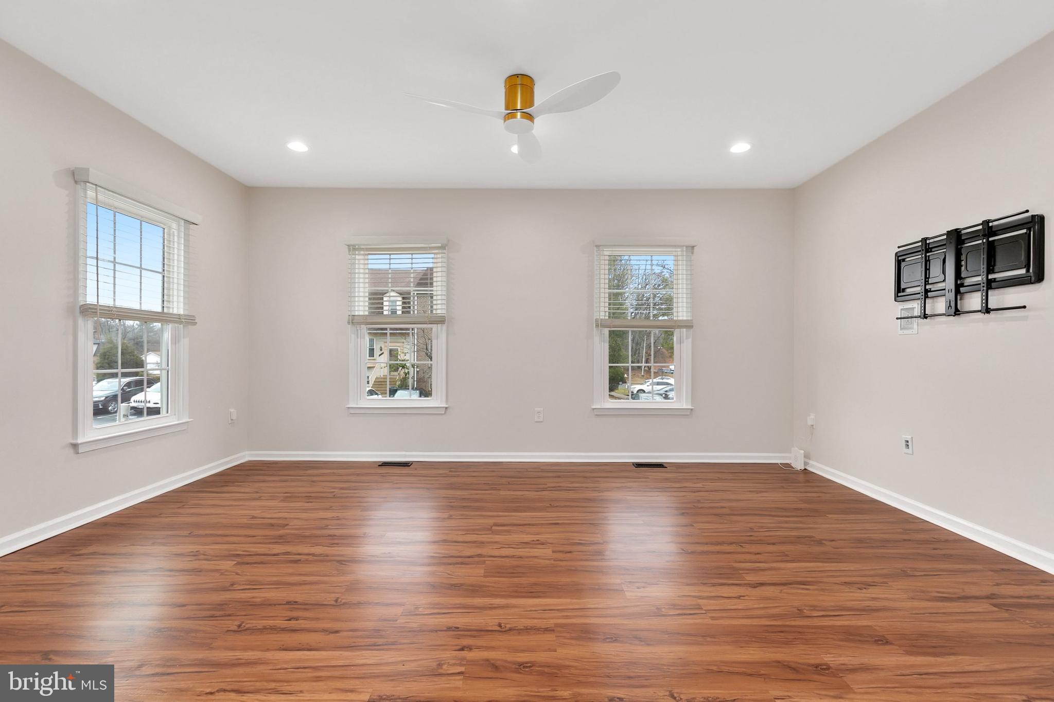3133 Beaverwood Lane Silver Spring, MD 20906 - Photo 5 of 41 a view of an empty room with window and wooden floor