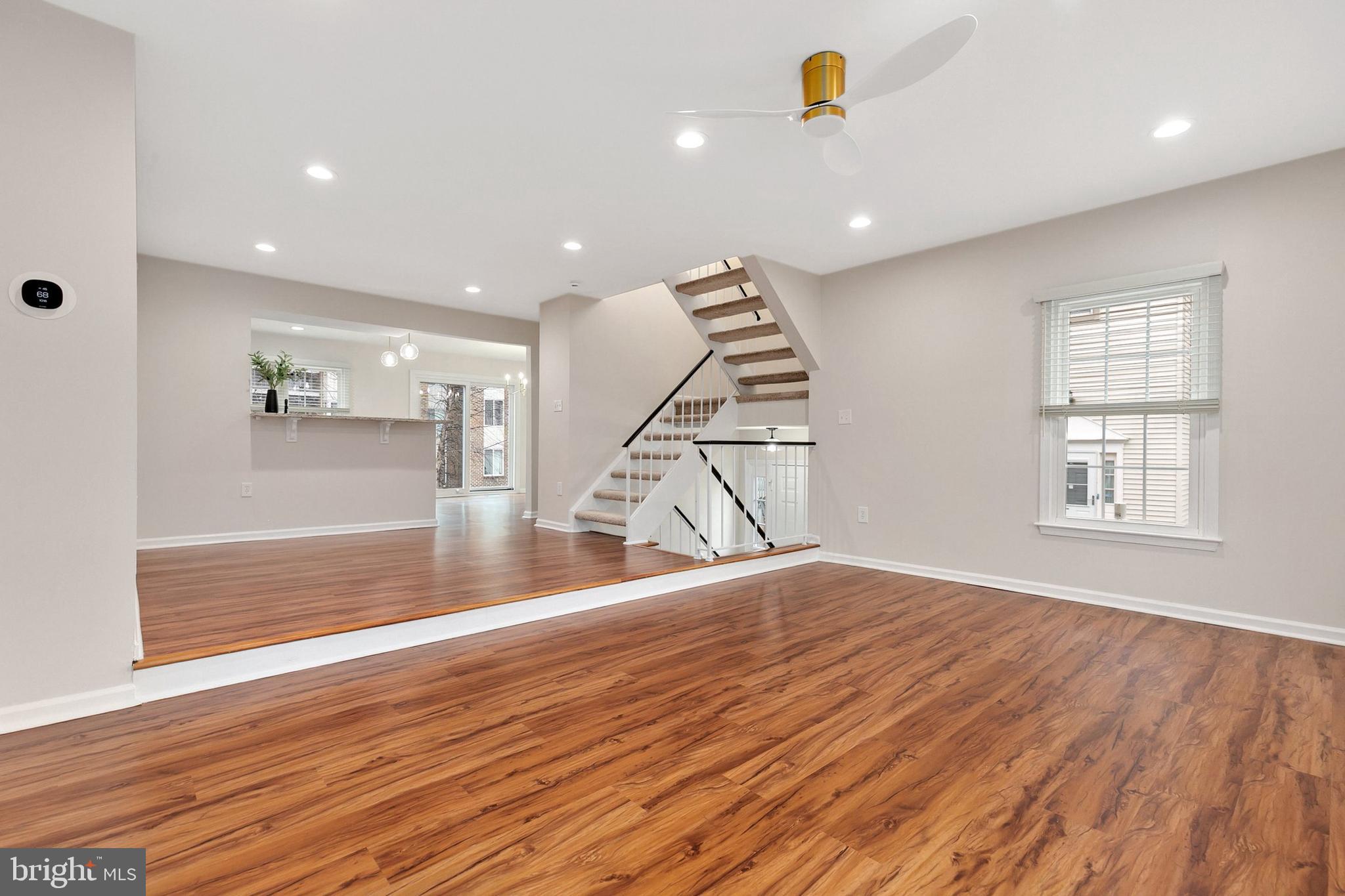 3133 Beaverwood Lane Silver Spring, MD 20906 - Photo 7 of 41 an empty room with wooden floor and windows