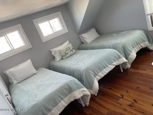 a bedroom with double bed and a window