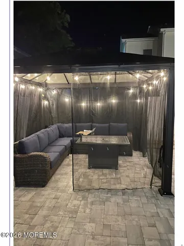 a room with furniture and a flat screen tv