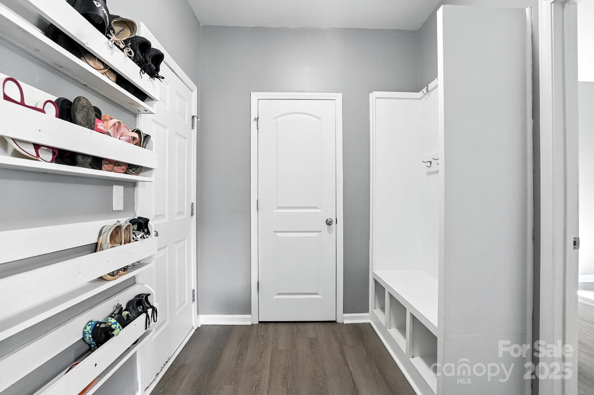 6405 Fawn Crest Drive Waxhaw, NC 28173 - Photo 14 of 38 a view of hallway with wooden floor and cabinets