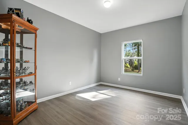 a bathroom with a sink vanity and a mirror