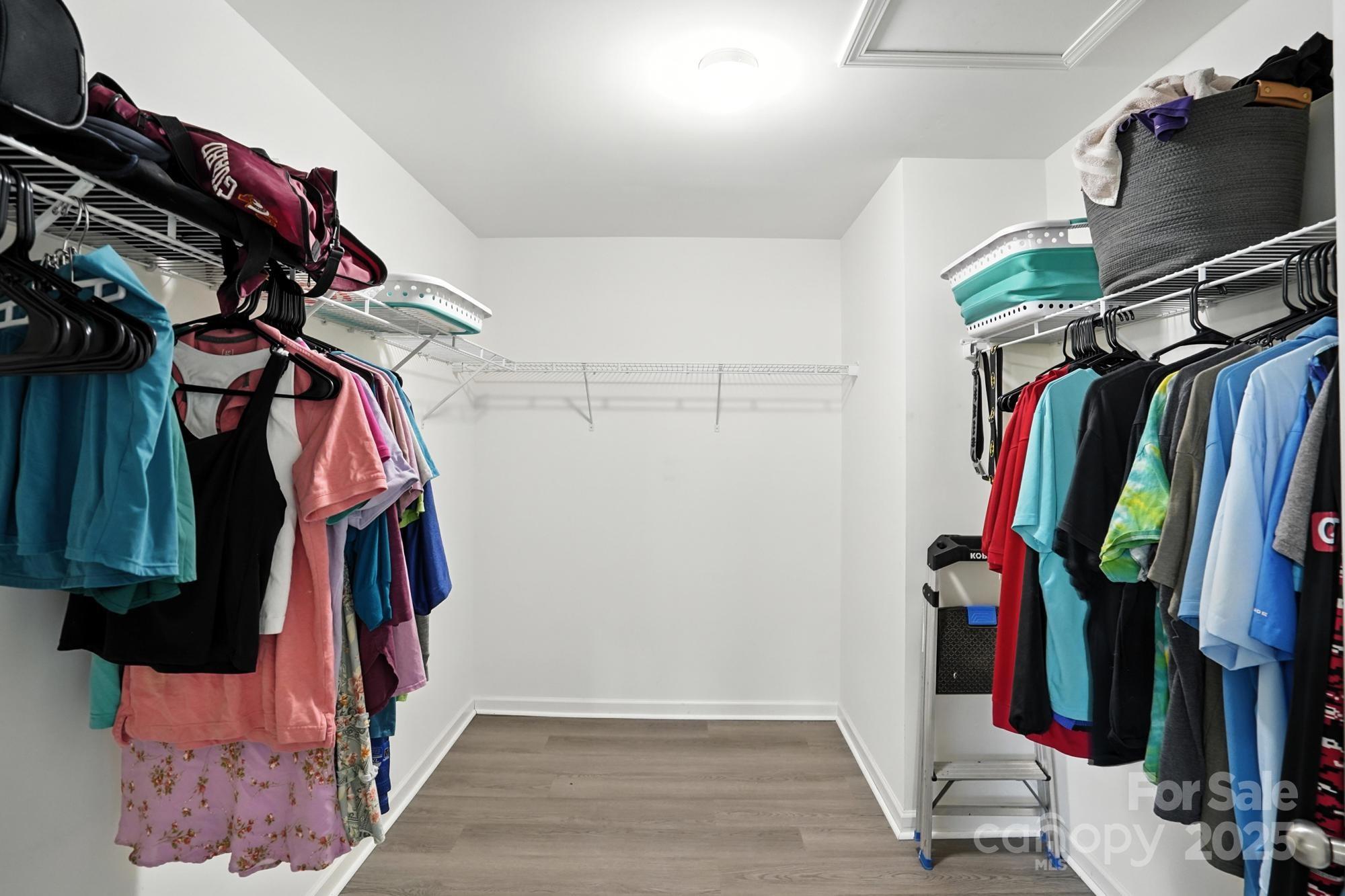 6405 Fawn Crest Drive Waxhaw, NC 28173 - Photo 22 of 38 a view of walk in closet with clothes and shoes