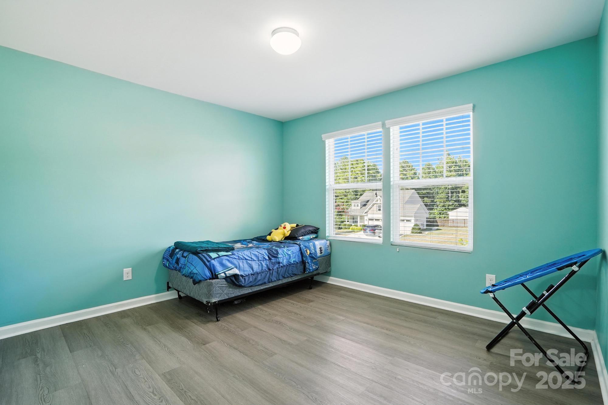 6405 Fawn Crest Drive Waxhaw, NC 28173 - Photo 23 of 38 a living room with furniture and a window
