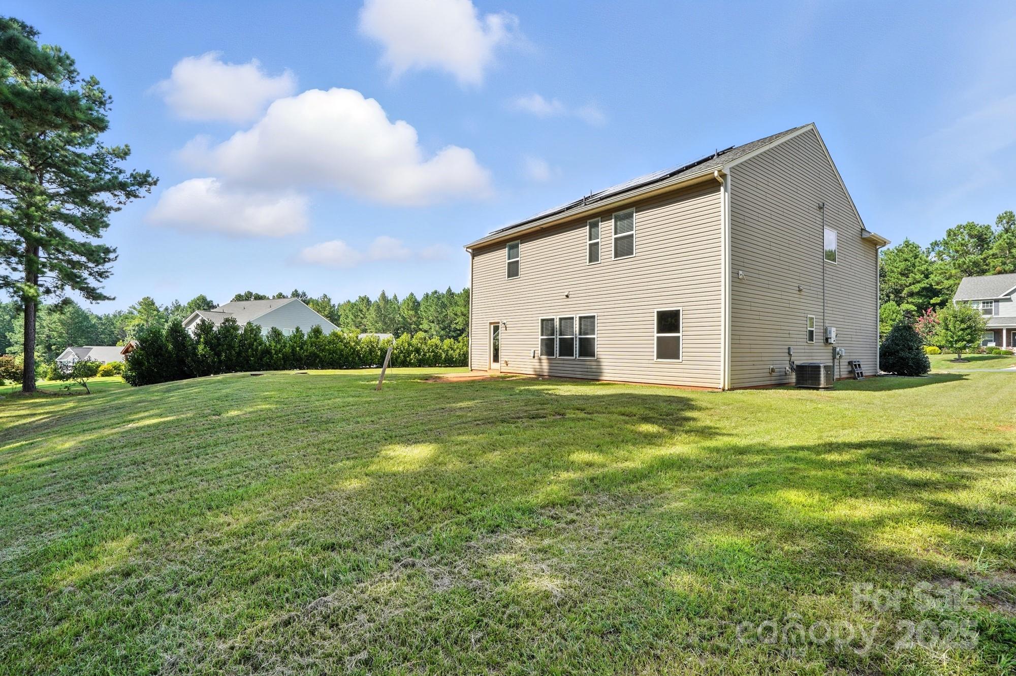 6405 Fawn Crest Drive Waxhaw, NC 28173 - Photo 32 of 38 a view of a backyard of the house