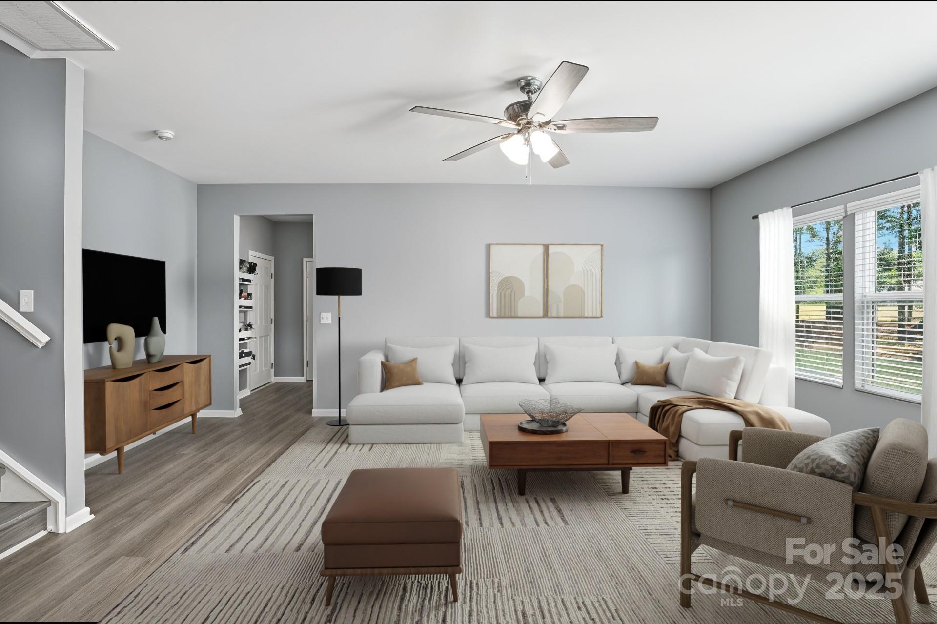 6405 Fawn Crest Drive Waxhaw, NC 28173 - Photo 8 of 38 a living room with furniture and a flat screen tv