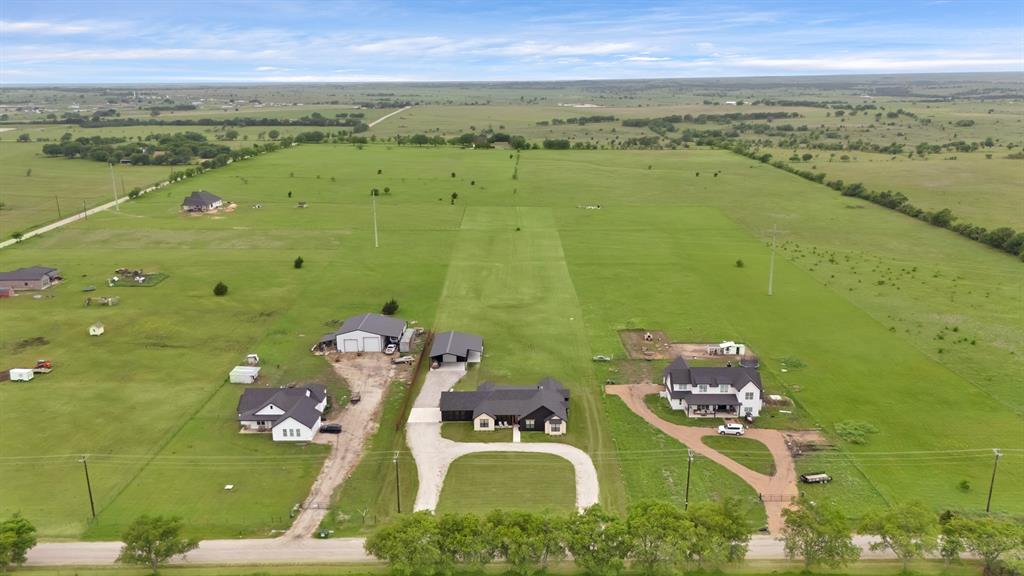 an aerial view of a house with a ocean view