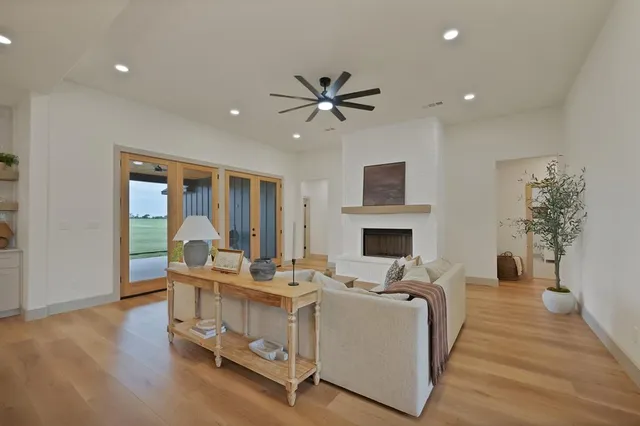 a living room with furniture fireplace and window