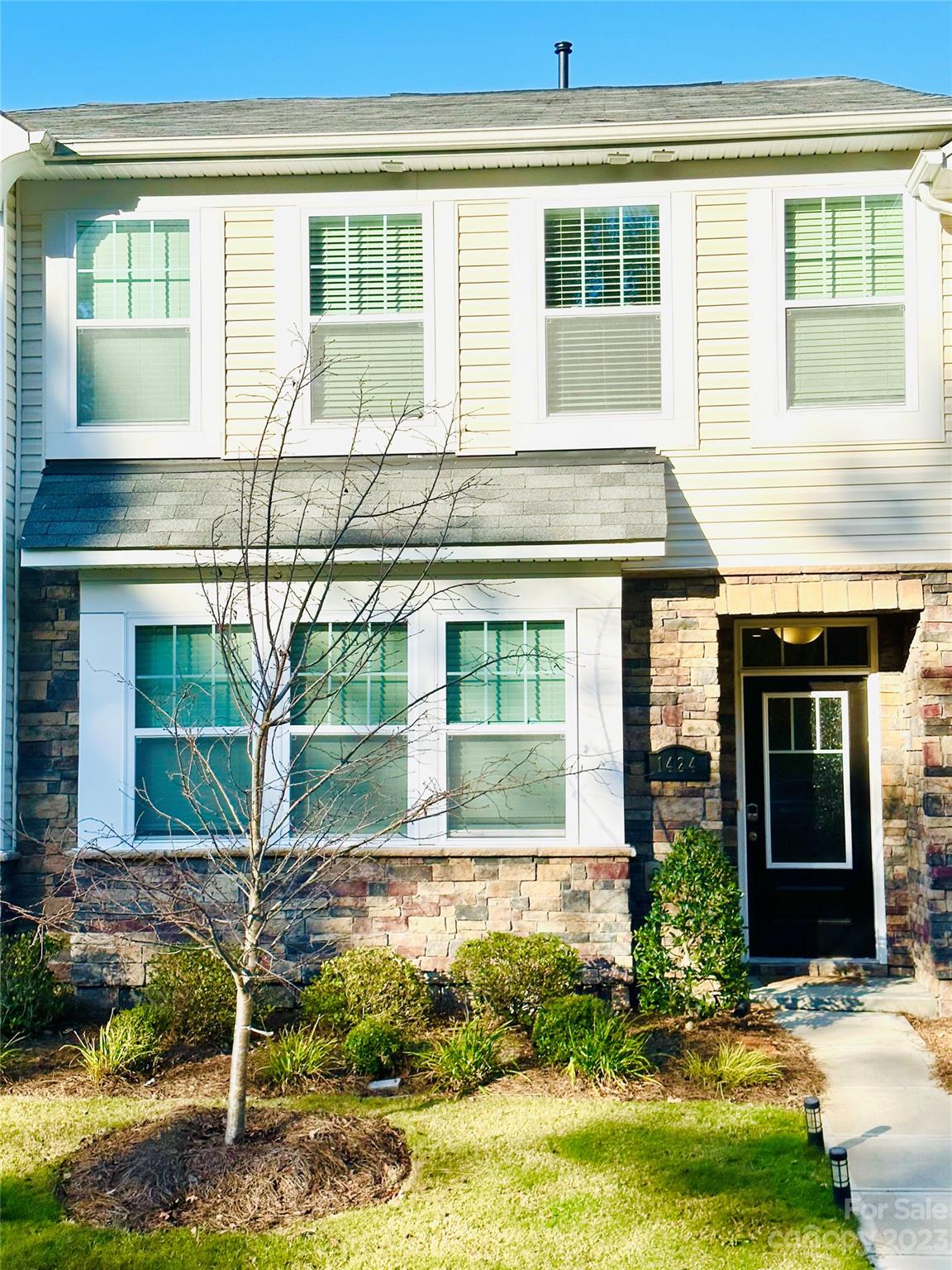 1424 Galloway Road Charlotte, NC 28262 - Photo 1 of 18 a front view of a house with a yard