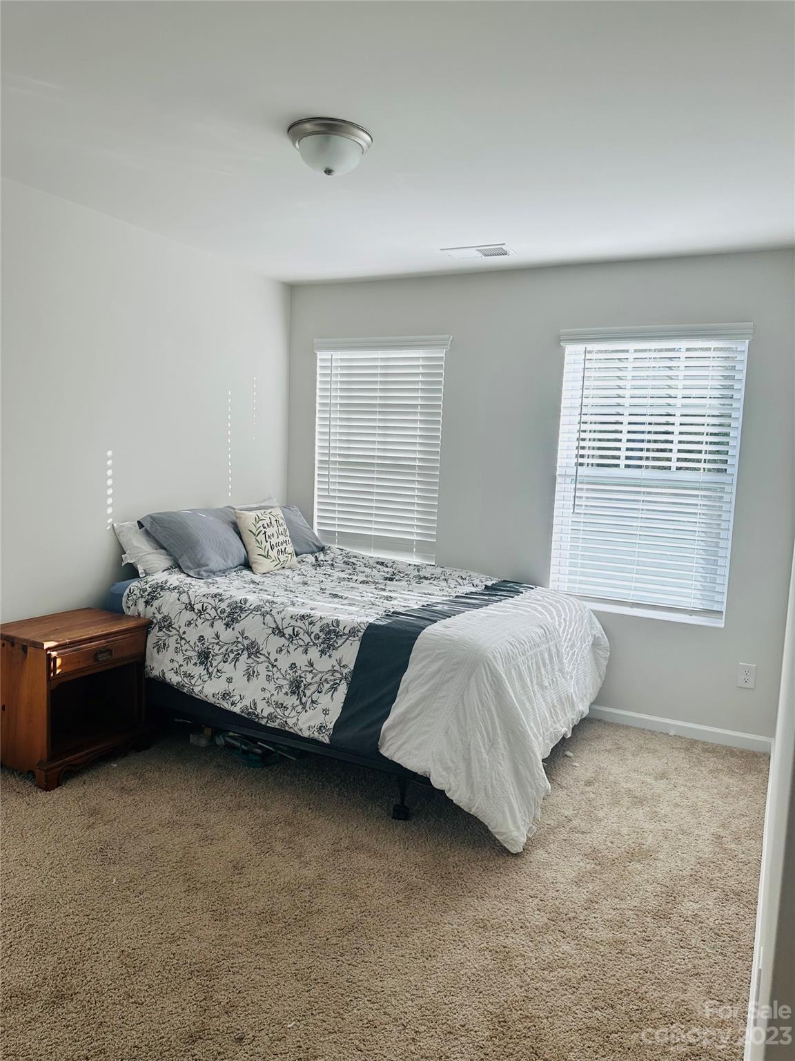 1424 Galloway Road Charlotte, NC 28262 - Photo 13 of 18 a bedroom with a bed and a couch