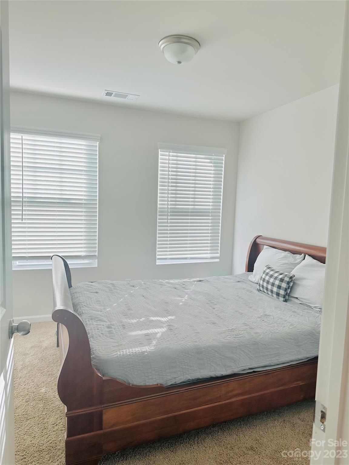 1424 Galloway Road Charlotte, NC 28262 - Photo 14 of 18 a bedroom with a bed and a window
