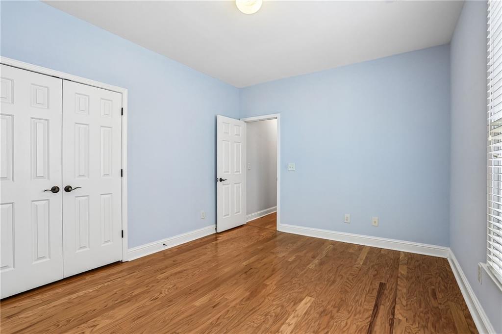 810 Freedom Way Cumming, GA 30040 - Photo 27 of 61 a view of an empty room with wooden floor