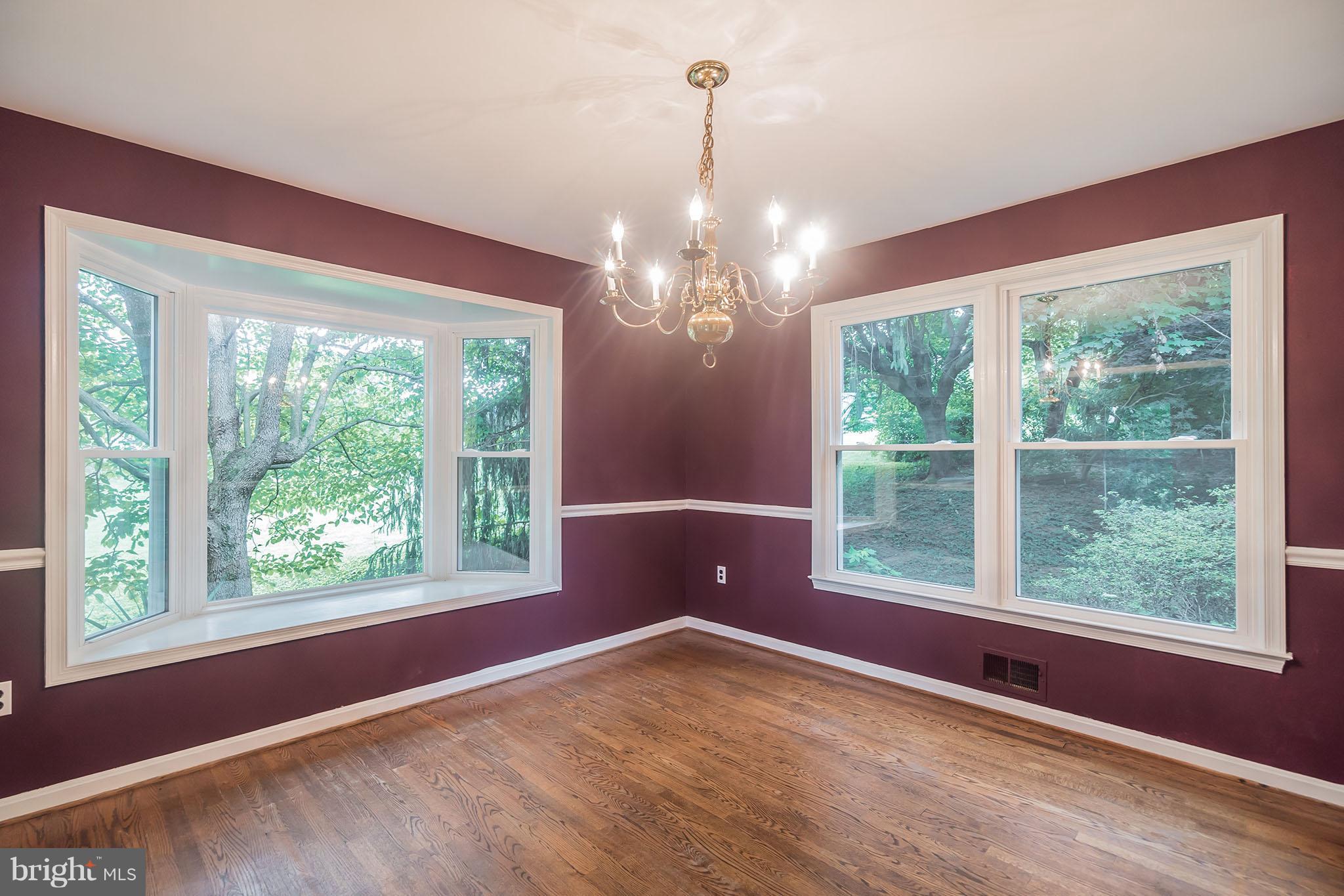 9448 Lovat Road Fulton, MD 20759 - Photo 7 of 30 a view of an empty room with wooden floor and a window