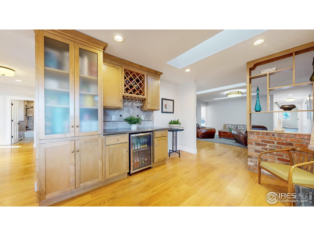 5708 South Timberline Road Fort Collins, CO 80528 - Photo 13 of 49 Open concept kitchen flows to a valuable storage and beverage center next to the dinging area and living areas